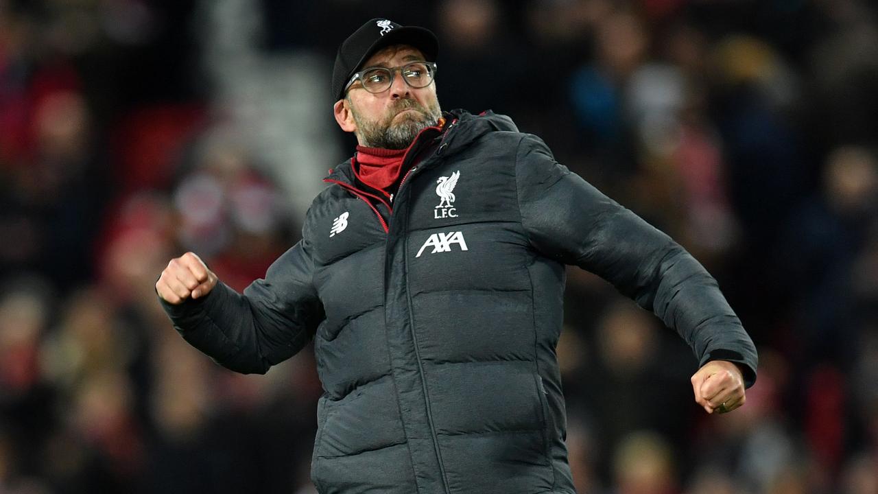 Jurgen Klopp celebrates on the pitch after Liverpool’s win over Everton at Anfield. Picture: AFP