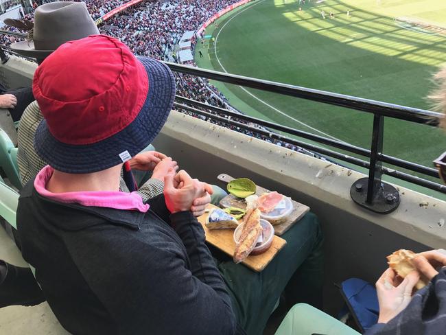 Melbourne fan Ned Trumble brought a cheese platter, including smashed avocado, to the MCG. Picture: Reddit/KrumDiddly