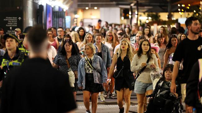 MELBOURNE, FEBRUARY 16, 2024: Taylor Swift fans outside Flinders Street Station after the first Melbourne concert during her Eras Tour. Picture: Mark Stewart