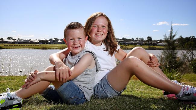 Chase with his sister Kyndra near his home in Spring Farm, in southwest Sydney. Picture: Toby Zerna