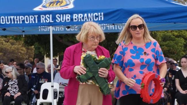 Retired councillor Dawn Crichlow with her sister-in-law, Samantha Delmege, who will contest Division 6 in Southport. Laying wreaths as the invitation of the RSL on Remembrance Day.