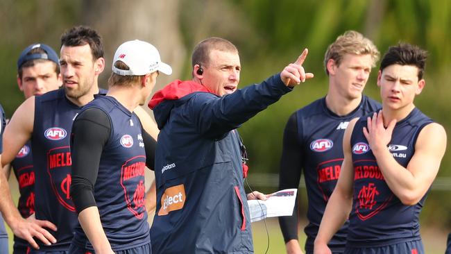 MELBOURNE, AUSTRALIA – AUGUST 24: Simon Goodwin, coach of the Demons speaks to his team during a break during a Melbourne Demons AFL training session at Gosch's Paddock on August 24, 2017 in Melbourne, Australia. (Photo by Scott Barbour/AFL Media/Getty Images)