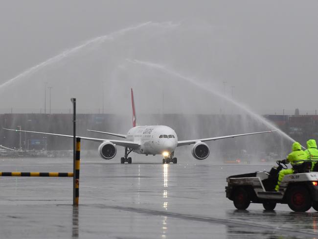 The new Dreamliner was welcomed to Sydney airport with a water cannon salute. Picture: AAP/Dean Lewins