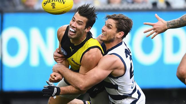 Alex Rance is tackled by Tom Hawkins. Picture: Getty