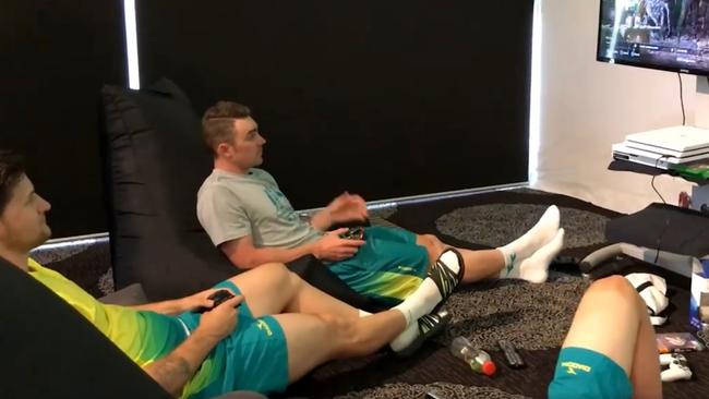 Pat Constable and Leigh Howard playing Xbox at their hotel.