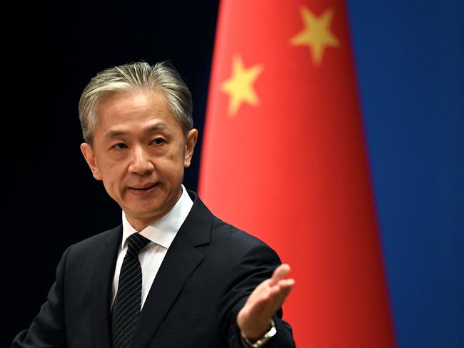 Chinese Foreign Ministry spokesman Wang Wenbin gestures during a press conference at the Ministry of Foreign Affairs in Beijing on August 8, 2022. (Photo by Noel Celis / AFP)