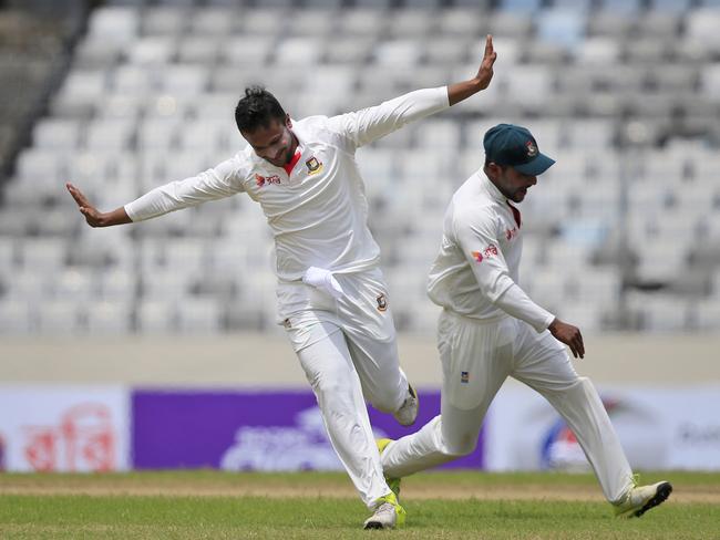 Bangladesh's Sakib Al Hasan, left, and his teammate Imrul Kayes celebrate the dismissal of Australia's Glenn Maxwell.