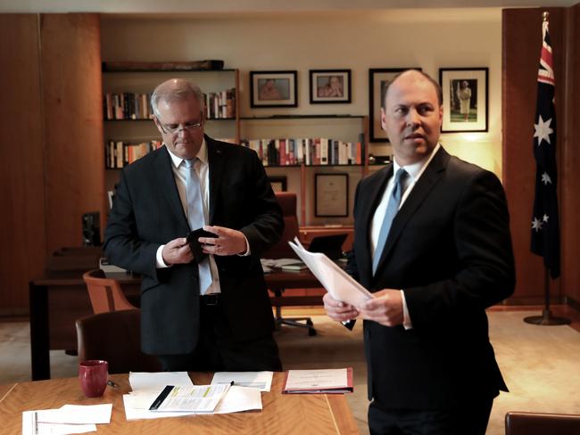 Prime Minister Scott Morrison (left) and Treasurer Josh Frydenberg put the finishing touches on the $130bn wage subsidy scheme before announcing the package in a media conference. Picture: Adam Taylor/PMO