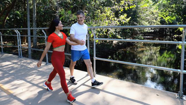 Edge Hill couple Gary Owens and Cristy Gelviro love an active lifestyle, walking together across Freshwater Creek in Goomboora Park, Brinsmead. Picture: Brendan Radke