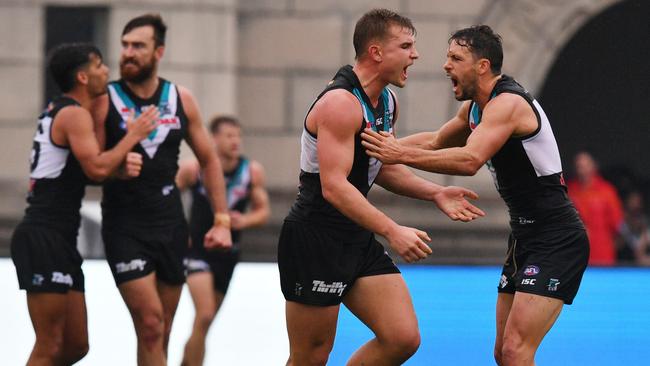 Ollie Wines celebrates a goal with Travis Boak of the Power against Gold Coast at Jiangwan Stadium in Shanghai, China. Picture: AAP Image/David Mariuz