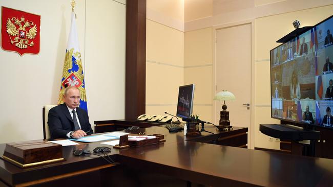 Vladimir Putin chairs a meeting with members of the government via a teleconference call at the state residence outside Moscow. Picture: AFP