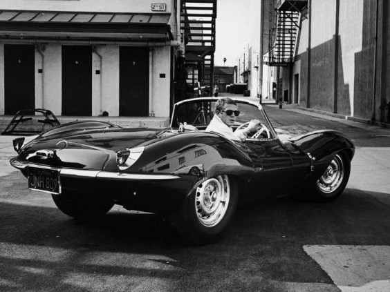 Actor Steve McQueen in his 1956 Jaguar Le Mans motor car.