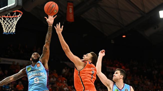 DJ Hogg of the Taipans drives to the basket under pressure during the round four NBL match between Cairns Taipans and New Zealand Breakers at Cairns Convention Centre. Picture: Emily Barker/Getty Images