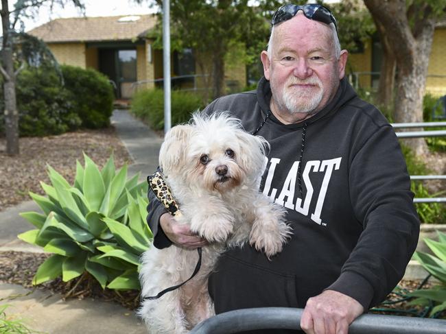 Housing Trust resident John Levins 66 and his dog Bindi at his Morphett Vale unit .Thursday,august,31,2023.Picture Mark Brake