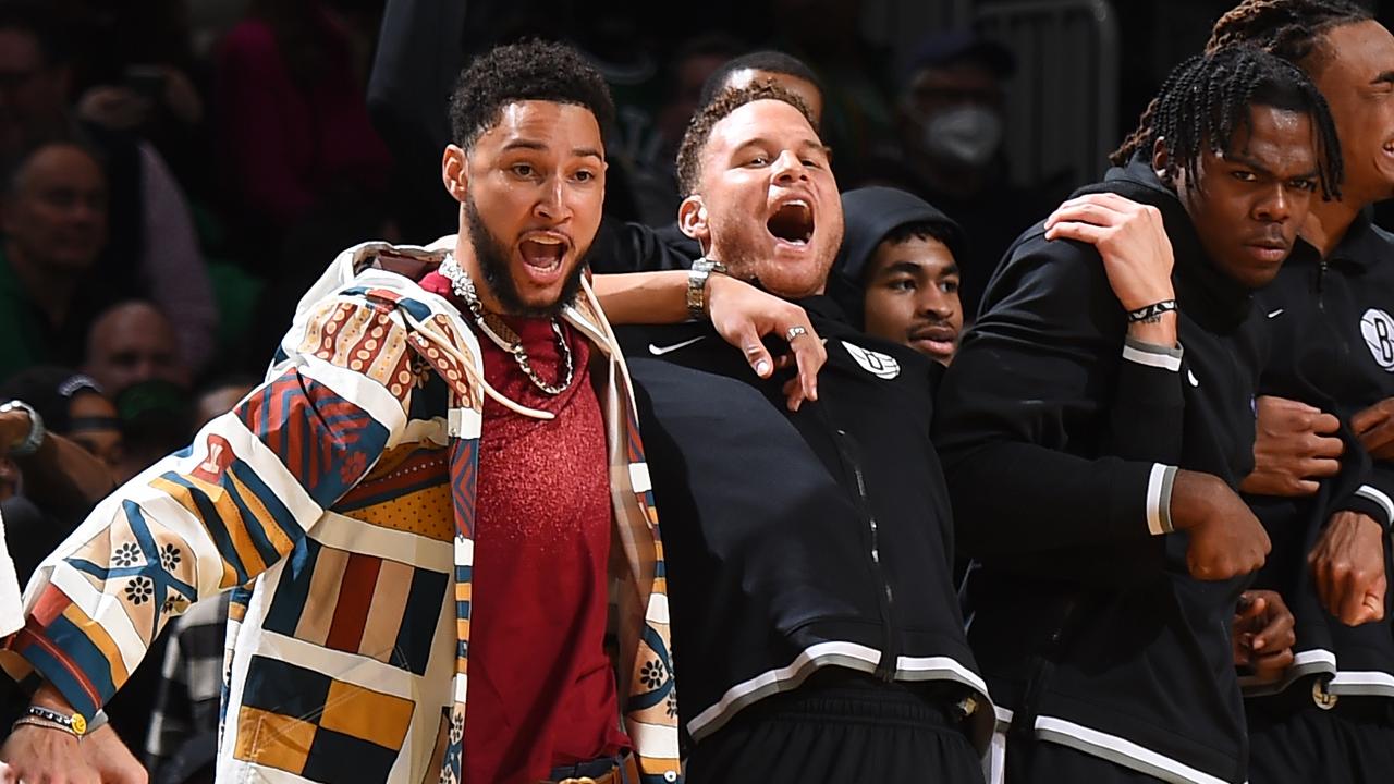 Simmons (L) watching the Nets on Thursday (AEDT) with power forward Blake Griffin. (Photo by Brian Babineau/NBAE via Getty Images)