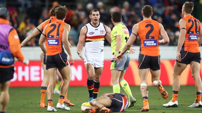 Taylor Walker complains to the umpire after having a free kick overturned for his sling tackle on Josh Kelly. Picture: Matt King/AFL Media/Getty Images)