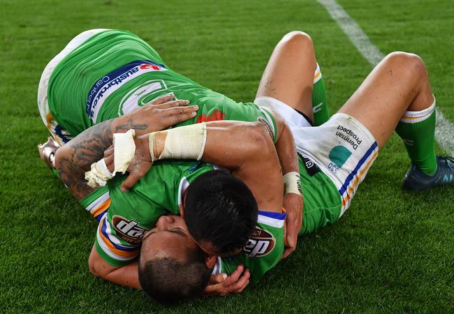 Raiders Joseph Leilua and Jordan Rapana embrace after their grand final loss.