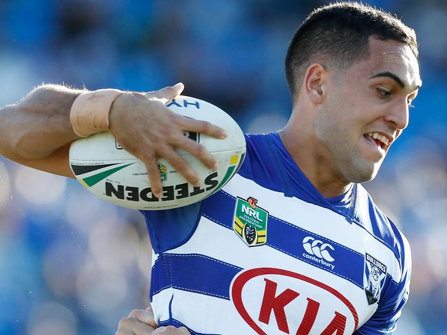 SYDNEY, AUSTRALIA - JUNE 16:  Reimis Smith of the Bulldogs is tackled during the round 15 NRL match between the Canterbury Bulldogs and the Gold Coast Titans at Belmore Sports Ground on June 16, 2018 in Sydney, Australia.  (Photo by Jason McCawley/Getty Images)