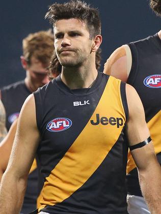 Trent Cotchin walks off after a Richmond defeat.