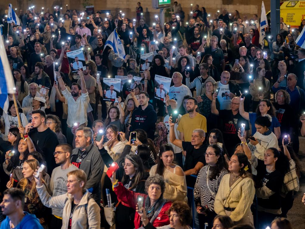 Thousands of people and the families of hostages hold up their mobile phones with the torch light on to sing the national anthem during the rally in support of the hostages that are still being held by Hamas. Picture: Alexi J. Rosenfeld/Getty Images