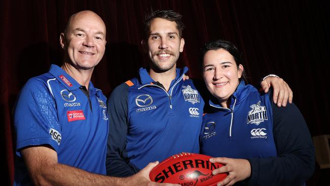 Laura Kane in her time at North Melbourne pictured with Darren Crocker and former player Jamie MacMillan Picture: LUKE BOWDEN