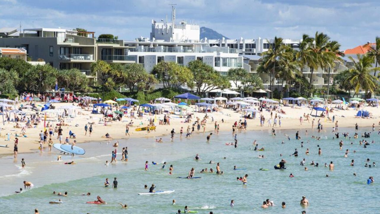 School holiday crowds pack into Noosa Main Beach.