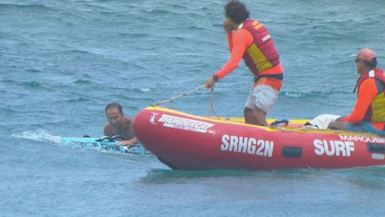 Lifeguards and Ironman competitors rushed to rescue 25 people from dangerous waters at a Sydney beach. Picture: Nine