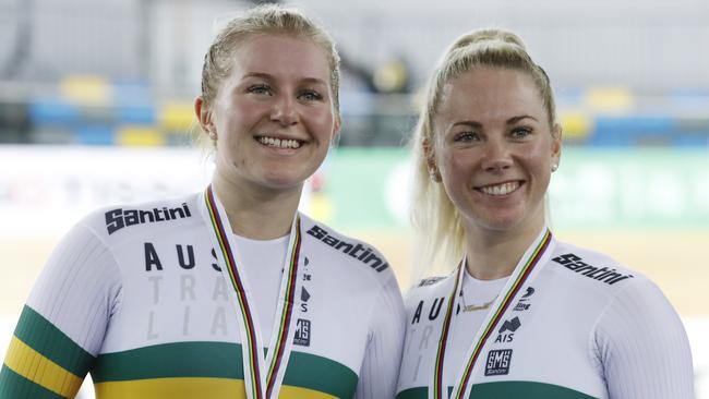 Australia's Stephanie Morton, left, and Kaarle McCulloch celebrate on the podium after winning the silver medal in the Team Sprint.