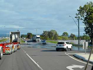 Water over the Warrego Highway at the Forest Hill Fernvale Road intersection. Picture: Adam Roberts