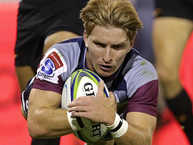 BUENOS AIRES, ARGENTINA - FEBRUARY 15:  Tate McDermott of Reds flies to score a try during a match between Jaguares and Reds as part of Super Rugby 2020 at Jose Amalfitani Stadium  on February 15, 2020 in Buenos Aires, Argentina. (Photo by Daniel Jayo/Getty Images)