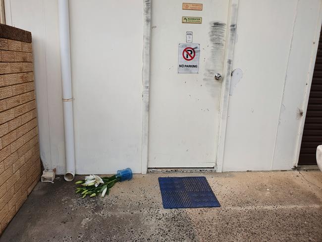 Some flowers left at Ms Rodgers’ door on Wednesday. Picture: Fiona Killman