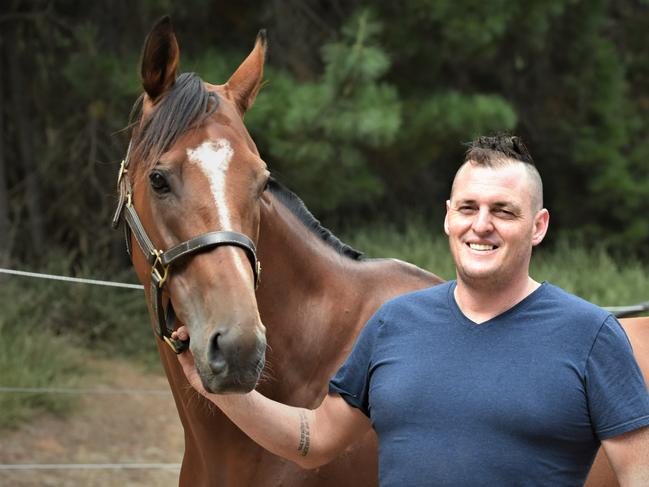 The Inevitable with trainer Scott Brunton at his Seven Mile Beach staples this week. Picture: Peter Staples