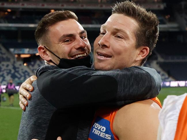 GEELONG, AUSTRALIA - AUGUST 06: Stephen Coniglio (left) and Toby Greene of the Giants celebrate during the 2021 AFL Round 21 match between the Geelong Cats and the GWS Giants at GMHBA Stadium on August 6, 2021 in Geelong, Australia. (Photo by Michael Willson/AFL Photos via Getty Images)