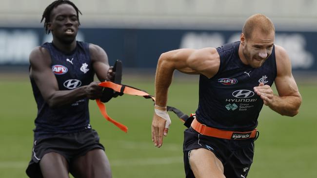 Dom Akuei trains with Harry McKay. Picture: Michael Klein