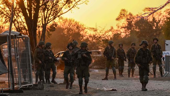 Israeli soldiers patrol near Kibbutz Beeri, the place where 270 revellers were killed by Hamas militants during the Supernova music festival. Picture: AFP