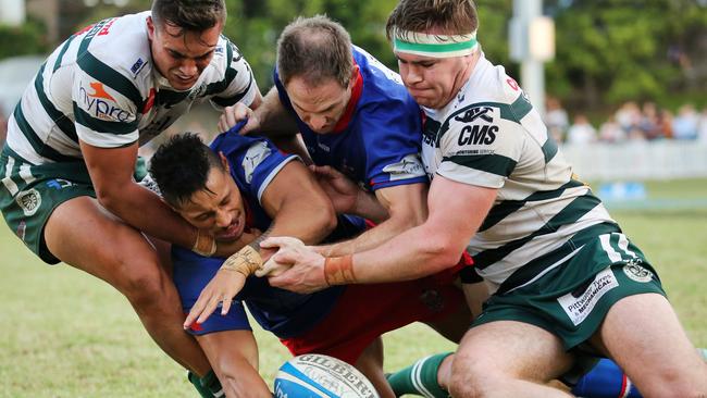 Manly’s Dennis Pili-Gaitua sandwiched in the local derby at Manly Oval last season. Picture: Karen Watson.