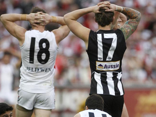 Brendon Goddard and Dayne Beams exhausted at the final siren in the drawn 2010 Grand Final. Picture: Phillip Stubbs