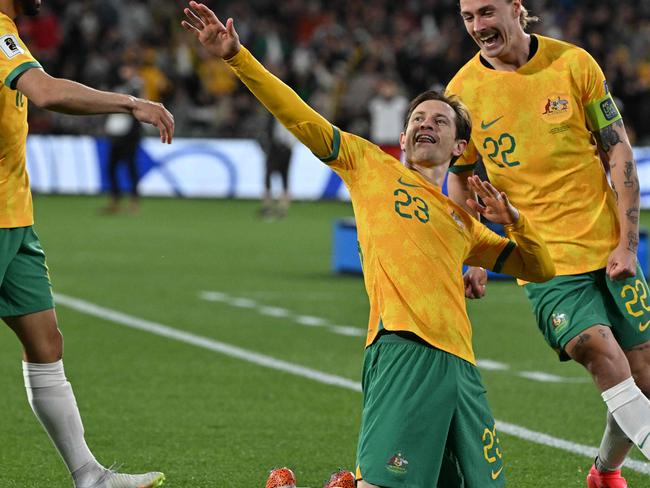 Australia's Craig Goodwin celebrates scoring a goal during the FIFA World Cup 2026 Asia zone qualifiers football match between Australia and China in Adelaide on October 10, 2024. (Photo by Brenton Edwards / AFP) / -- IMAGE RESTRICTED TO EDITORIAL USE - STRICTLY NO COMMERCIAL USE --