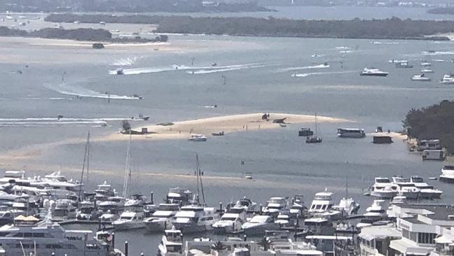 Image of the moments after two helicopters collided and crashed on a sandbar near Sea World. Picture: Sue Donovan