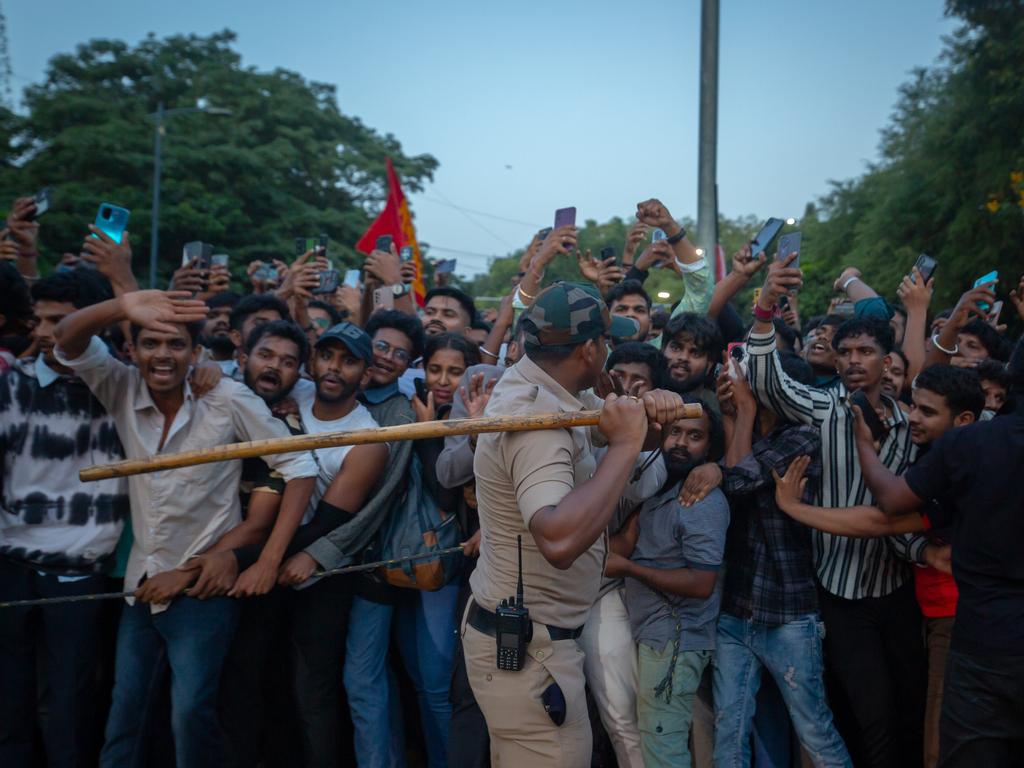 Police officers try to control fans. Picture: Abhishek Chinnappa/Getty Images