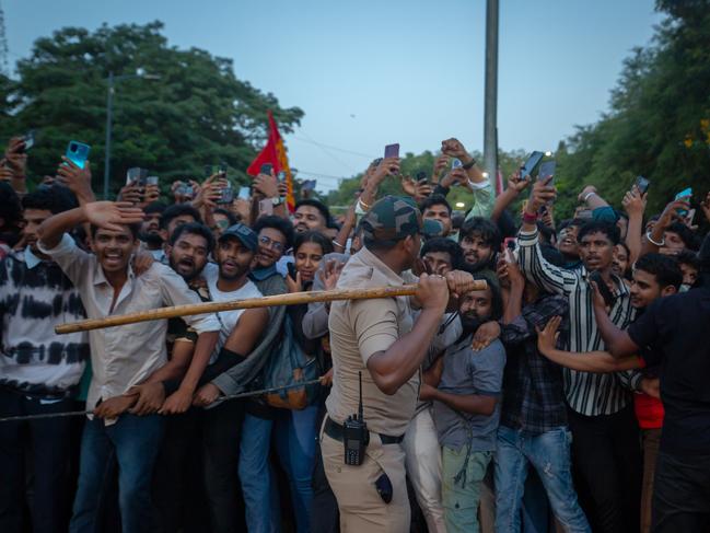 Police officers try to control fans. Picture: Abhishek Chinnappa/Getty Images