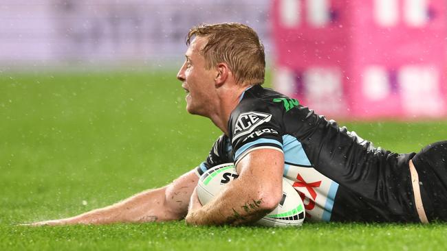 Lachie Miller slides over for a try (Photo by Chris Hyde/Getty Images)