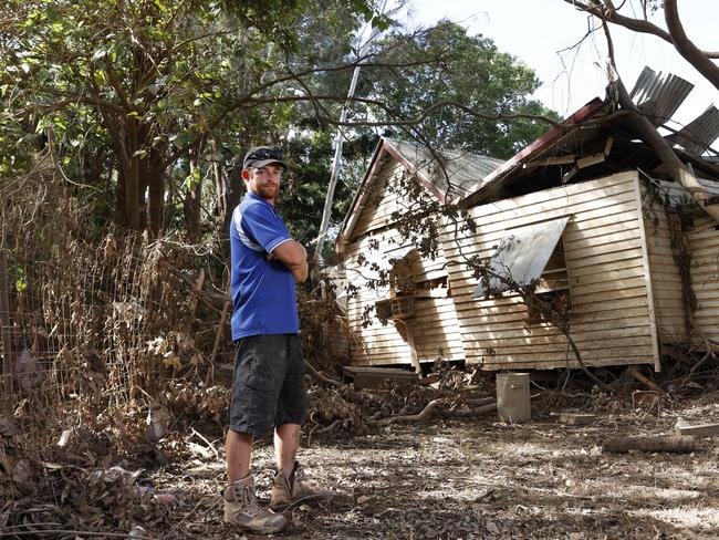 Mitch Moore outside what is left of his home on Lake St in North Lismore on March 9 last year. Picture: Jonathan Ng