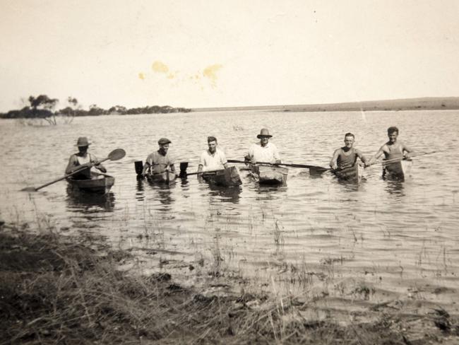 Great Grandfather Reg Koch secnd from left, in a regatta with neighbours on Gordon’s Lagoon after the foods of 1933. Picture: Emma Brasier