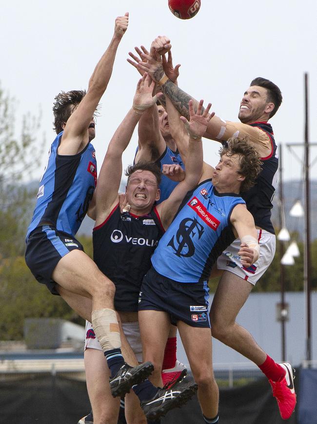 Norwood’s Sam Baulderstone was the meat in the sandwich against Sturt at Unley Oval on Sunday. But the big man finished on top with 61 hit-outs, including 24 to advantage. Picture: Emma Brasier.