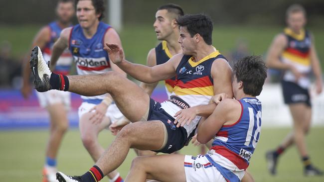 Adelaide’s Darcy Fogarty tangles with Central's Jaxon Neagle in the SANFL this month. Picture: AAP Image/Dean Martin