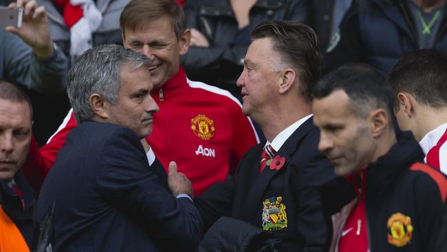 Chelsea's manager Jose Mourinho, left, greets Manchester United manager Louis van Gaal.