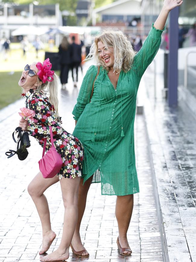 Racegoers pose at the Melbourne Cup. Picture: AAP Image/Con Chronis