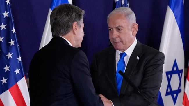 Israeli Prime Minister Benjamin Netanyahu (R) shakes hands with US Secretary of State Antony Blinken in Tel Aviv.