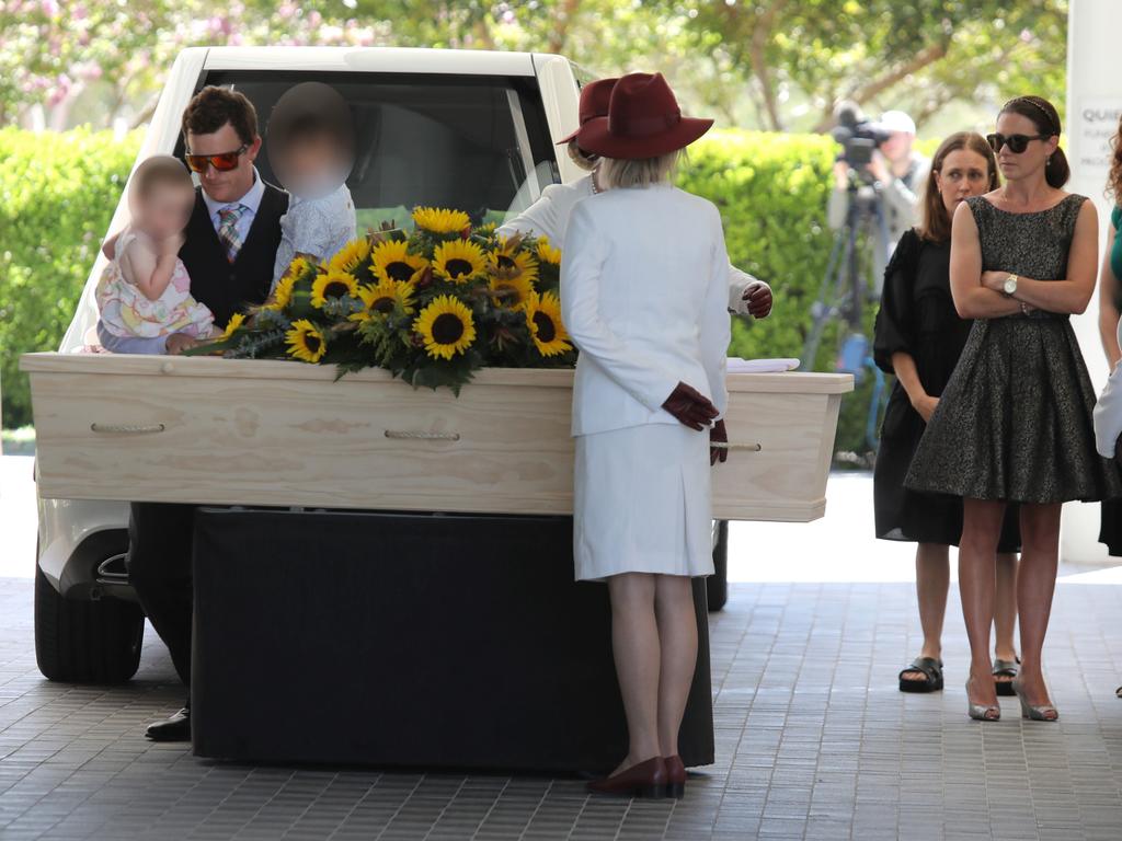 Jessica Locke looks on at the casket as other relatives say goodbye. Picture: NCA NewsWire/Philip Gostelow